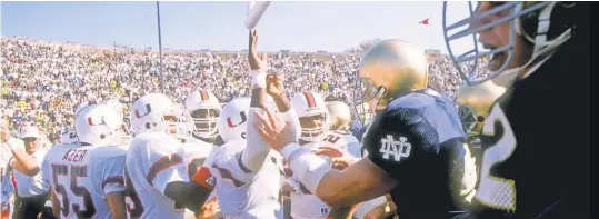  ?? 1988 PHOTO BY JONATHAN DANIEL, GETTY IMAGES ?? Miami players running through Notre Dame’s warm- up area sparked a pregame brawl between the teams.