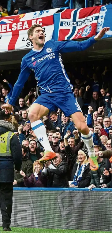  ?? — Reuters ?? Defender’s high: Chelsea’s Marcos Alonso celebrates after scoring against Arsenal in the English Premier League match at Stamford Bridge on Feb 4. Chelsea won 3-1.