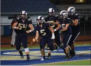  ?? AUSTIN HERTZOG - MEDIANEWS GROUP ?? Spring-Ford’s Nick Teets (5) is congratula­ted by teammates after scoring a touchdown against Perkiomen Valley this season.