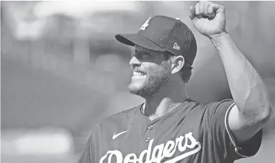  ?? JOE CAMPOREALE / USA TODAY SPORTS ?? Dodgers lefthander Clayton Kershaw, waving to fans during a spring training game, will be paid $ 31 million.