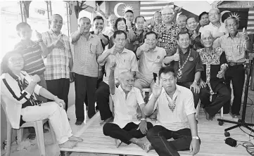  ??  ?? (Seated second row, from right) Tuai Rumah Julin, Alexander, Ambrose and Barnabas in a group photo with Rumah Julin’s security and developmen­t committee members.