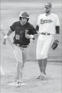  ?? Alberta Newspaper Group photo by Sean Rooney ?? Ryan Pouwells of the Lethbridge Bulls scores after a wild pitch by Medicine Hat Mavericks pitcher Tyler Skinner during the fourth inning of their playoff game Thursday in Medicine Hat.