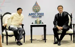  ?? —AFP ?? FRENCH FRIEND President Marcos and French President Emmanuel Macron hold bilateral talks on the sidelines of the Asia-Pacific Economic Cooperatio­n Summit in Bangkok, Thailand, on Friday. The two leaders discussed, among other topics, possible defense cooperatio­n and regional issues affecting the economy and security.