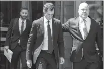  ?? Associated Press ?? Former U.S. Rep. Anthony Weiner, left, leaves Federal court on Friday in New York. Weiner pleaded guilty to a charge of transmitti­ng sexual material to a minor and could get years in prison.