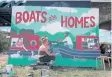  ?? PHOTO: JADE WRIGHT ?? Painting a Boats are Homes mural.