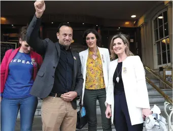  ??  ?? Taoiseach Leo Varadkar waves to a passerby as he poses with (left to right) Theresa Newman and deputies Kate O’Connell and Maria Bailey while canvassing in Tullamore. Photo: Damien Eagers