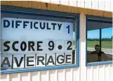  ??  ?? Incoming pilots are given a rating for their landings by the watching fire crew who display their score and the occasional comment on the station window at the end of the runway.