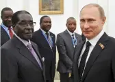  ??  ?? Tyrants together: The Zimbabwe leader was a guest of Putin at the Kremlin in 2015