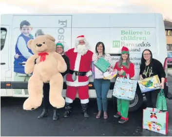  ??  ?? So generous Barrhead Travel staff from East Kilbride with the goodies from their charity drive