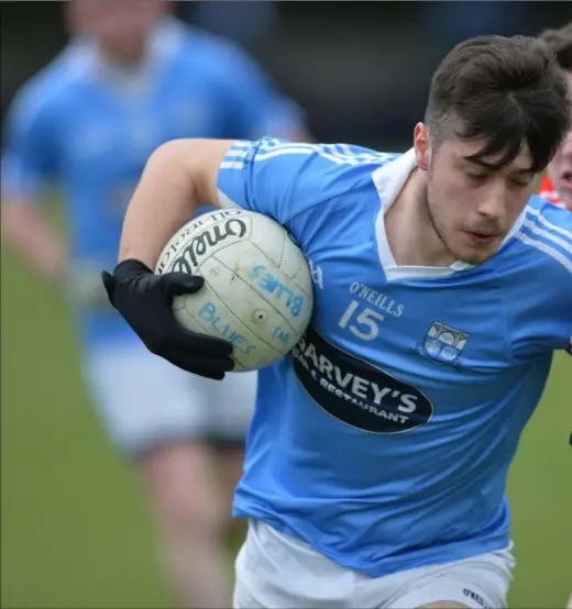  ??  ?? Jamie Doherty of Newtown Blues breaks clear of Ciaran Deane of St Brides.