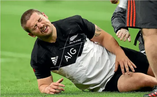  ?? PHOTOSPORT ?? Dane Coles down injured during the All Blacks’ game with France.