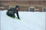  ?? PHOTO SUBMITTED BY KERRY KLINE ?? Children took to the hill at Rupert Elementary School in Pottstown for some sledding Wednesday.