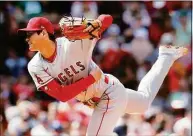  ?? Michael Dwyer / Associated Press ?? Los Angeles Angels’ Shohei Ohtani pitches during the fourth inning against the Boston Red Sox on Thursday in Boston.