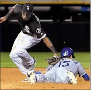  ?? AP/DAVID BANKS ?? of the Kansas City Royals steals second as Chicago White Sox shortstop Tim Anderson makes a late tag during an Aug. 1 game in Chicago. Merrifield led the majors with 45 steals last season.