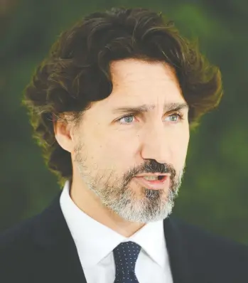  ?? SEAN KILPATRICK / THE CANADIAN PRESS ?? Prime Minister Justin Trudeau on Friday at his daily press conference at Rideau Cottage when he said “the premiers
and I will work for a safe restart agreement which would cover the next critical six to eight months.”