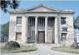  ??  ?? LEFT TO ROT: An abandoned building stands in the premises of Athens Art School. Such buildings are common in the Greek capital.