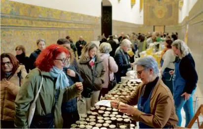  ?? LAURA LEON/ASSOCIATED PRESS ?? Customers bought marmalades and cakes, made by nuns, at a market at the Reales Alcazares in Seville, Spain, earlier this month.