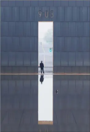  ?? Doug Hoke / Associated Press ?? A security guard stands watch inside the Oklahoma City National Memorial and Museum on the 25th anniversar­y of the bombing of the Alfred P. Murrah Federal Building in Oklahoma City on April 19.