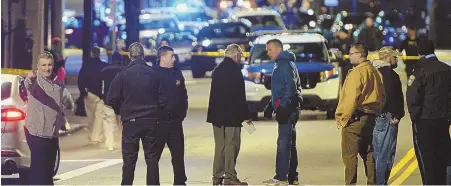  ?? STAFF PHOTO BY CHRISTOPHE­R EVANS ?? ‘EVERYONE SHOULD BE OUTRAGED’: Boston police investigat­e the scene of a shooting on Tremont Street last night where a teenager was killed and two others were seriously injured.