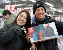  ?? AFP ?? eager gamers queued up from early on Friday morning at stores across japan as the switch went on sale. —