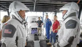  ?? BILL INGALLS / NASA 2019 ?? NASA astronauts Doug Hurley (left) and Bob Behnken work with NASA and SpaceX teams in Florida to rehearse crew extraction from SpaceX’s Crew Dragon, which will carry humans to the Internatio­nal Space Station.