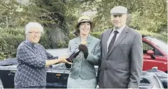  ??  ?? Best dressed couple: Stephen and Denise Cherry were presented with a bottle of Champagne by the Revd Gerry Burgess, priest-in-charge of the Wildbrooks Churches