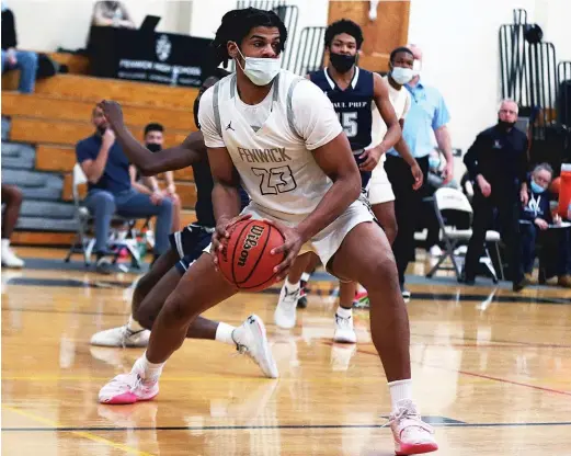  ?? ALLEN CUNNINGHAM/SUN-TIMES ?? Fenwick star Bryce Hopkins grabs a rebound and steps toward the basket Friday against DePaul Prep. He scored 16 points in the Friars’ victory.