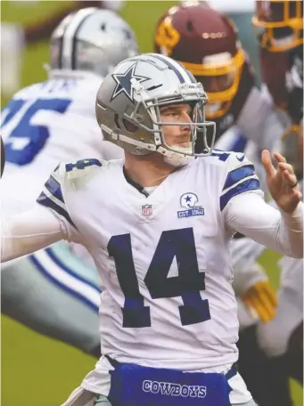  ?? PATRICK MCDERMOTT/GETTY IMAGES ?? Cowboys QB Andy Dalton has tested positive for COVID-19 and is out this week, despite having recovered from a concussion that kept him out of Sunday night's loss to the Eagles.