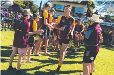  ??  ?? The Charters Towers Under 16 Miners are clapped on to the field by club players and members ahead of their game against Centrals Tigers at the Bill Lewis Oval on Saturday.