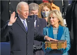  ?? Picture: EPA-EFE ?? PROMISE. Joe Biden is sworn in as the 46th president of the United States as Jill Biden holds the Bible.