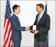  ?? SUBMITTED PHOTO ?? U.S. Rep. Ryan Costello congratula­tes Christian Molfetto, a senior at Coventry Christian Schools in Lower Pottsgrove Township, for earning The Congressio­nal Award Bronze Medal.