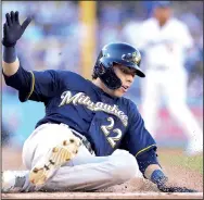  ?? AP/GARY A. VASQUEZ ?? Christian Yelich of the Milwaukee Brewers scores during the first inning of Game 3 of the National League Championsh­ip Series against the Los Angeles Dodgers on Monday in Los Angeles. The Brewers won 4-0 to take a 2-1 series lead.