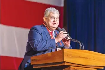  ?? ARVIN TEMKAR/THE ATLANTA JOURNAL-CONSTITUTI­ON/TNS ?? In June, outgoing Georgia GOP Chair David Shafer introduces a speaker at the Georgia GOP convention in Columbus.