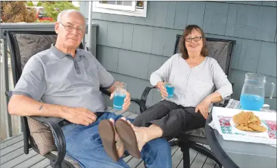  ?? SHARON MONTGOMERY-DUPE/CAPE BRETON POST ?? Cecil Saccary and his wife Rita Saccary relax on the deck of their home in Glace Bay. The Saccarys, who managed the Glace Bay Shoe Store for 17 years, have retired and the storeowner­s have closed the downtown business.