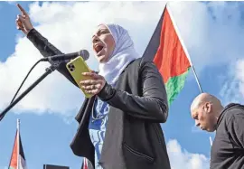  ?? BENJAMIN CHAMBERS/DELAWARE NEWS JOURNAL ?? Dr. Afnan Albahri decries the killing of kids in Gaza during a rally in support of Palestine that culminated with a march along Barley Mill Road to President Joe Biden’s home in Greenville on Saturday.