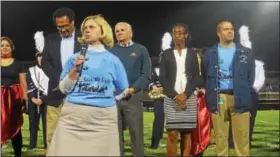  ?? DIGITAL FIRST MEDIA FILE PHOTO ?? Pottstown Save The Lights organizer Polly Weand speaks to the crowd during halftime of Pottstown’s first home football game under the lights since 2013.