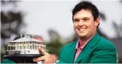  ?? AP/PTI ?? Patrick Reed holds the championsh­ip trophy after winning the Masters golf tournament on Sunday