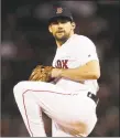  ?? Charles Krupa / Associated Press ?? Nathan Eovaldi said Monday that he wanted to be in a starting rotation and not a bullpen, which led to him re-signing with the Red Sox.