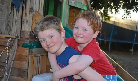  ??  ?? BEST FRIENDS: Ayden Driscoll (left) plays with his brother Ashah Driscoll in their backyard.