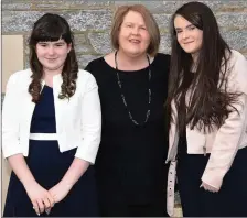  ??  ?? Aden Clifford who made her Confirmati­on with her Mother Marie Therese and sister Eida at Holy Cross Church, Kenmare.