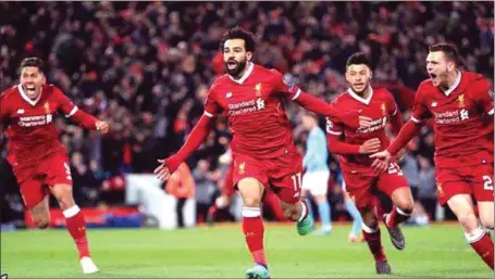  ??  ?? Mo Salah (2nd left) scored the opening goal as Liverpool defeated Man City 3-0 in the UEFA Champions League quarter final first leg clash last night