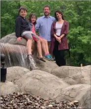  ?? PHOTO PROVIDED ?? Nick Brumley, Sarah Brumley, Brian Brumley and Kristen Beach Eglintine smile at the new Olde Saratoga Miniature Golf course in Wilton.