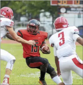  ?? GREGG SLABODA — TRENTONIAN PHOTO ?? Trenton’s Thomeir Richardson (center) looks for running room against Rancocas Valley.