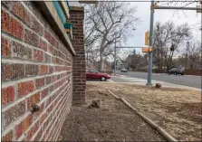  ?? JOHNNIE ST. VRAIN — LONGMONT TIMES-CALL ?? A zigzag of newer mortar and two rods mark the section of a porch wall that was struck by a car after a driver swerved to miss another car at the intersecti­on of Ninth Avenue and Collyer Street, seen in the background.