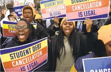  ?? ANNA ROSE LAYDEN NYT ?? Demonstrat­ors gather outside the Supreme Court, which is hearing two cases Tuesday about student debt. The court insists that initiative­s with major political and economic consequenc­es be authorized by Congress.