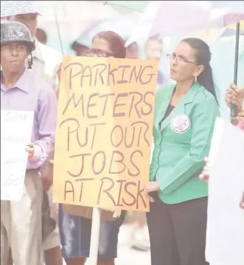  ??  ?? Several city business people and their employees have made complaints about a reduction in business activity since the implementa­tion of the parking meters near their stores.