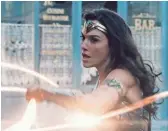  ?? WARNER BROS. ENTERTAINM­ENT ?? Wonder Woman (Gadot) wields her Lasso of Truth, refusing to be sidelined by the guys.