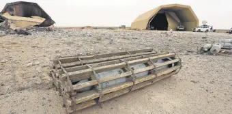  ??  ?? A view of a discarded aircraft-mounted explosive outside a hangar at Al-Watiya air base, southwest of the capital Tripoli, after the strategic location was seized by forces loyal to Libya’s U.N.-recognized Government of National Accord (GNA), Libya, May 18, 2020.