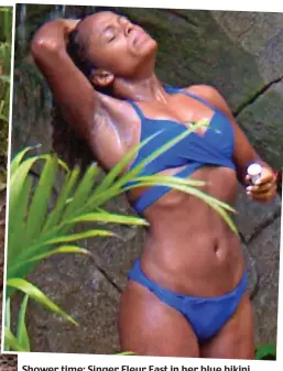  ??  ?? Shower time: Singer Fleur East in her blue bikini
