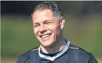  ?? Picture: SNS. ?? John Rankin enjoys a laugh at United training at St Andrews yesterday.
